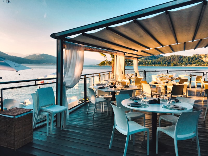 Waterfront dining terrace at La Tavola Dorata